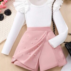 CONJUNTO MANGAS LARGAS BLANCO CON SHORT POLLERA ROSA CON PERLITAS T 12 AÑOS