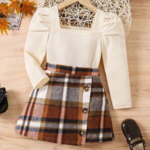 CONJUNTO 2 PIEZAS, REMERA MANGA LARGA BEIGE CON POLLERA CUADRICULADA T 7 AÑOS