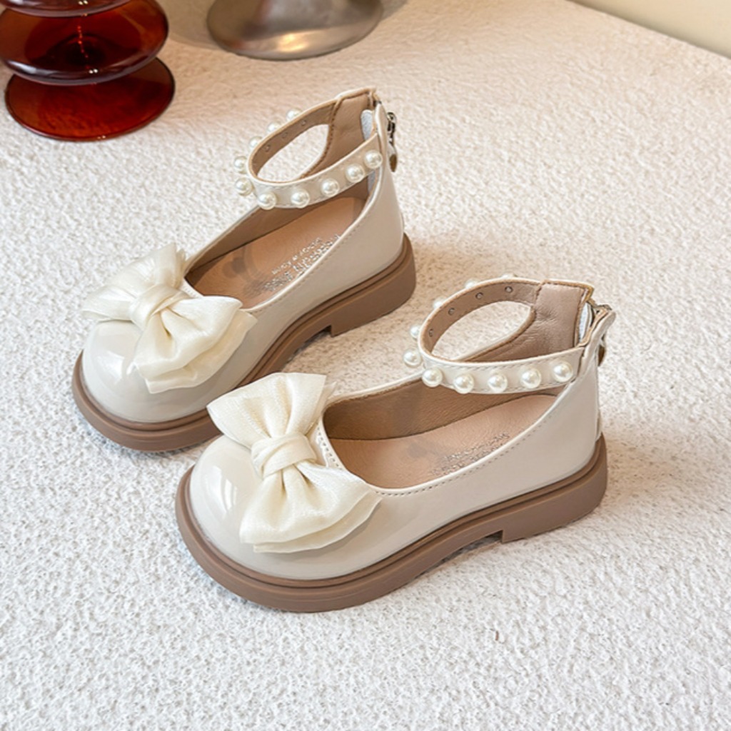 ZAPATITO BEIGE DETALLES PERLITAS Y MOÑO